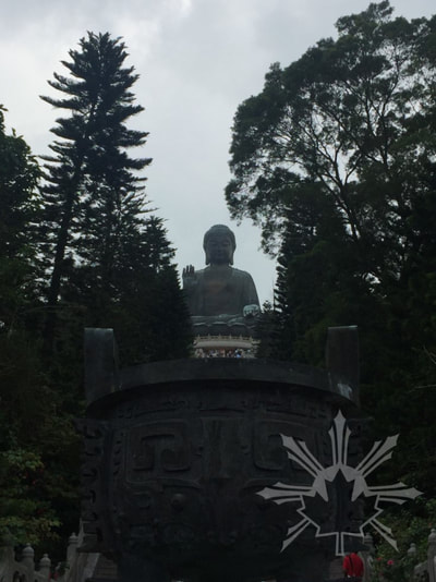 Tian Tan Buddha through the trees